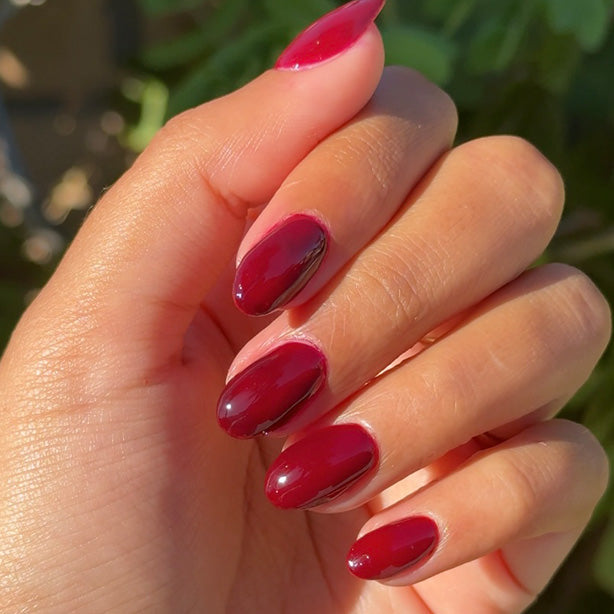 hand with dark red polish