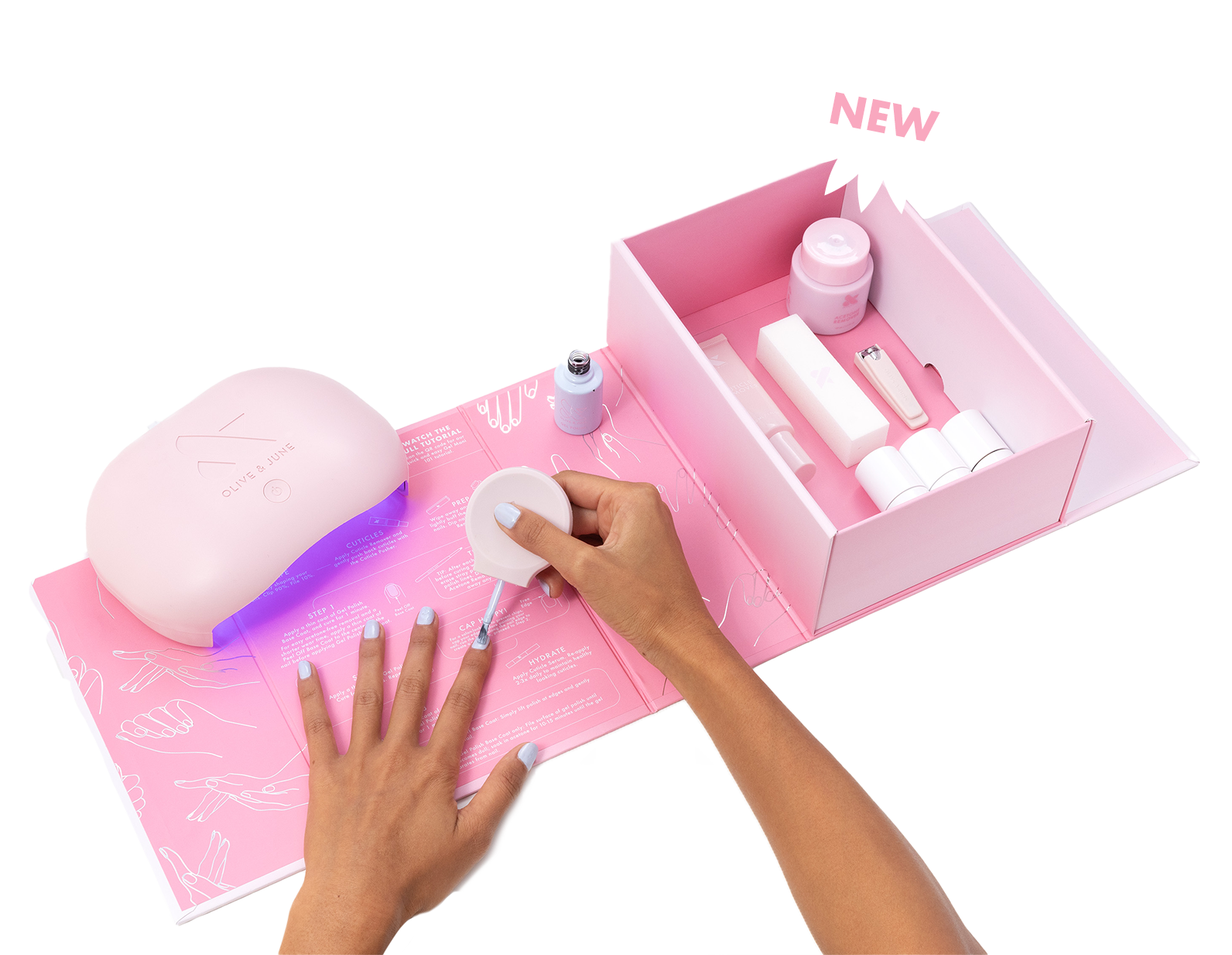 a hand painting nails, with a uv lamp and nail tools